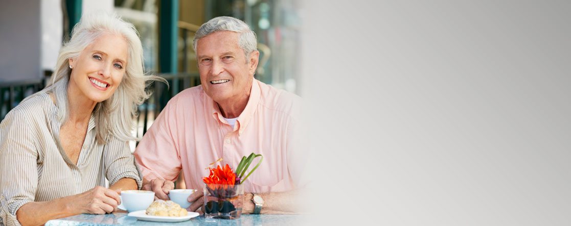 Restorative Dentistry and Elderly couple eating lunch and smiling